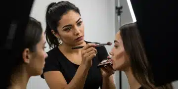 Celebrity makeup artist applying contouring products in studio setting