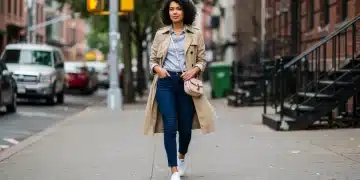 Woman in affordable stylish outfit walking city street