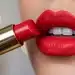 Woman with vibrant, long-lasting red lipstick