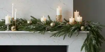 Winter mantel detail showing mixed texture elements including faux fur, wooden candle holders, and glass ornaments